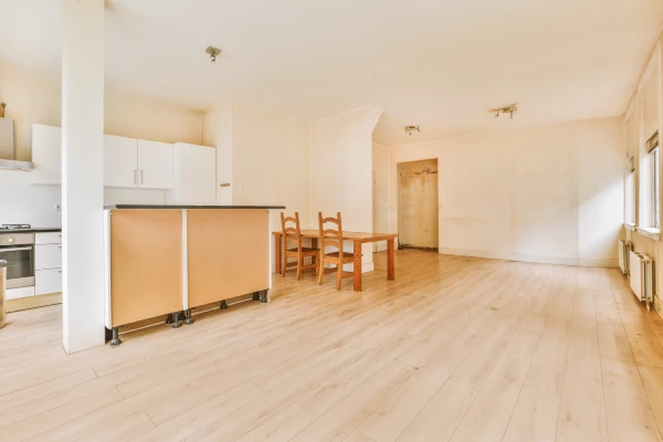 Cleaner mopping empty rental before inspection